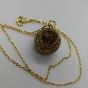 Gold glitter ball revealing quartz and tigers eye